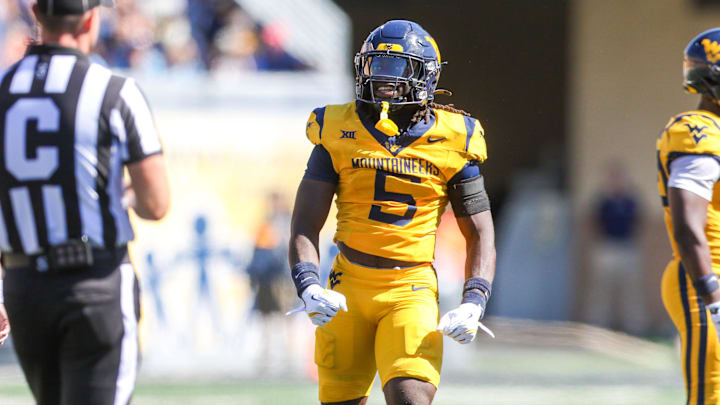 Aug 30, 2025; Morgantown, West Virginia, USA; West Virginia Mountaineers safety Fred Perry (5) celebrates after a tackle for loss during the second quarter against the Robert Morris Colonials at Milan Puskar Stadium. Mandatory Credit: Ben Queen-Imagn Images