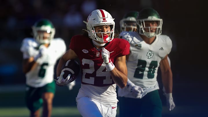 Sep 7, 2024; Stanford, California, USA; Stanford Cardinal wide receiver Tiger Bachmeier (24) returns a punt for a touchdown against the Cal Poly Mustangs during the second half at Stanford Stadium. Mandatory Credit: Sergio Estrada-Imagn Images Sep 7, 2024; Stanford, California, USA; Stanford Cardinal wide receiver Tiger Bachmeier (24) returns a punt for a touchdown against the Cal Poly Mustangs during the second half at Stanford Stadium. Mandatory Credit: Sergio Estrada-Imagn Images