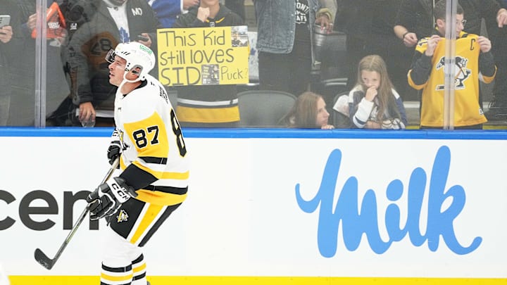 Oct 12, 2024; Toronto, Ontario, CAN; Pittsburgh Penguins center Sidney Crosby (87) skates past a fan holding a sign during the warmup before a game against the Toronto Maple Leafs at Scotiabank Arena. Mandatory Credit: Nick Turchiaro-Imagn Images