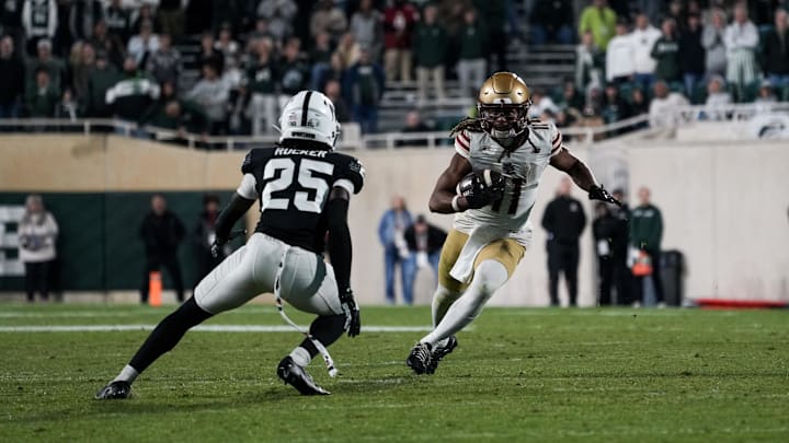 Sep 6, 2025; East Lansing, Michigan, USA; Boston College wide receiver Lewis Bond (11) runs with the ball after a catch in overtime at Spartan Stadium. Mandatory Credit: Brendan Mullin-Imagn Images Sep 6, 2025; East Lansing, Michigan, USA; Boston College wide receiver Lewis Bond (11) runs with the ball after a catch in overtime at Spartan Stadium. Mandatory Credit: Brendan Mullin-Imagn Images