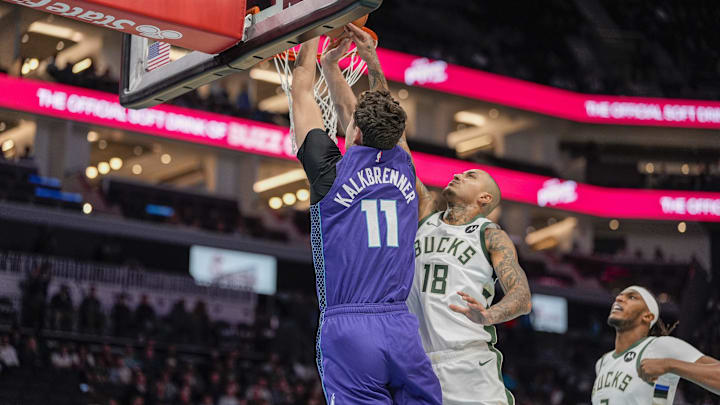 Nov 12, 2025; Charlotte, North Carolina, USA; Charlotte Hornets center Ryan Kalkbrenner (11) goes to the basket defended by Milwaukee Bucks forward Kyle Kuzma (18) during the first quarter at Spectrum Center. Mandatory Credit: Jim Dedmon-Imagn Images Nov 12, 2025; Charlotte, North Carolina, USA; Charlotte Hornets center Ryan Kalkbrenner (11) goes to the basket defended by Milwaukee Bucks forward Kyle Kuzma (18) during the first quarter at Spectrum Center. Mandatory Credit: Jim Dedmon-Imagn Images