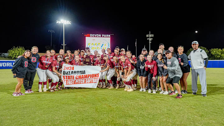 Owasso celebrates winning the Oklahoma Class 6A high school softball state championship game between Owasso and Choctaw in Oklahoma City on Saturday, Oct. 19, 2024.