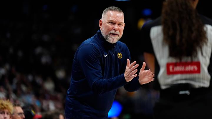 Apr 6, 2025; Denver, Colorado, USA; Denver Nuggets head coach Michael Malone reacts towards referee Danielle Scott (87) in the second half against the Indiana Pacers at Ball Arena. Mandatory Credit: Ron Chenoy-Imagn Images
