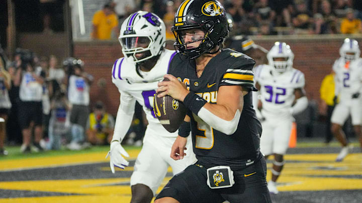 Aug 28, 2025; Columbia, Missouri, USA; Missouri Tigers quarterback Beau Pribula (9) runs in for a touchdown against the Central Arkansas Bears during the second half of the game at Faurot Field at Memorial Stadium. Mandatory Credit: Denny Medley-Imagn Images