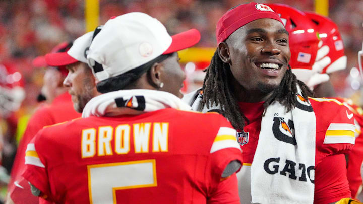 Kansas City Chiefs wide receiver Hollywood Brown (5) and wide receiver Rashee Rice (4) laugh on the sidelines against the Chicago Bears during the game at GEHA Field at Arrowhead Stadium.
