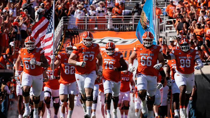 Oct 5, 2024; Stillwater, Oklahoma, USA; Oklahoma State Cowboys enters the field for a game against the West Virginia Mountaineers at Boone Pickens Stadium. Mandatory Credit: William Purnell-Imagn Images