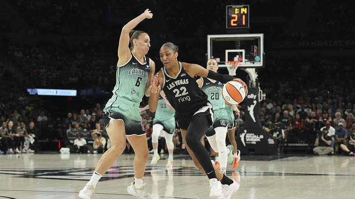 Aug 13, 2025; Las Vegas, Nevada, USA; Las Vegas Aces center A'ja Wilson (22) drives against New York Liberty forward Stephanie Talbot (6) during the first quarter of their game at Michelob Ultra Arena. Mandatory Credit: Candice Ward-Imagn Images