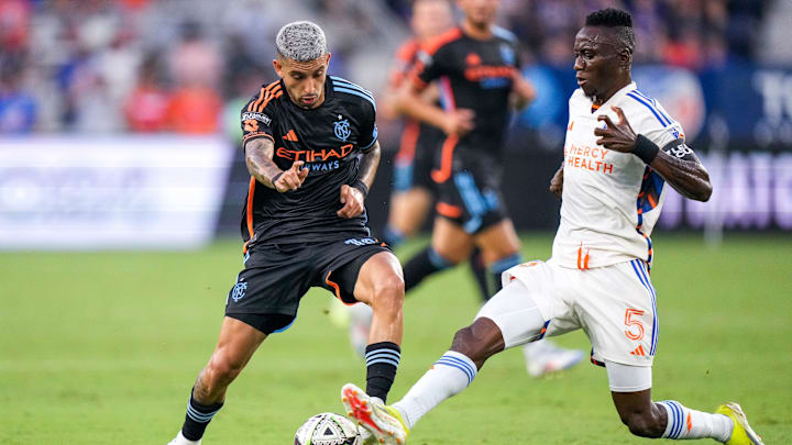 New York City midfielder Santiago Rodriguez (10) and FC Cincinnati midfielder Obinna Nwobodo (5)  