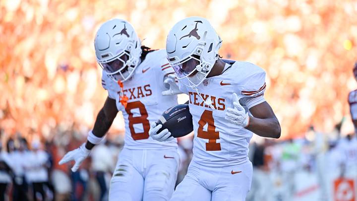 Texas Longhorns wide receiver Jermaine Bishop Jr. (4) and wide receiver Cam Coleman (8) celebrate after scoring a touchdown against the Oklahoma Sooners during the game between the Sooners and the Longhorns at Cotton Bowl. 