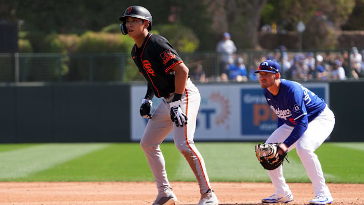 Mar 1, 2025; Phoenix, Arizona, USA; San Francisco Giants outfielder Jung Hoo Lee (51) leads off first as Los Angeles Dodgers first baseman Griffin Lockwood-Powell (72) covers the bag during the third inning at Camelback Ranch-Glendale. Mar 1, 2025; Phoenix, Arizona, USA; San Francisco Giants outfielder Jung Hoo Lee (51) leads off first as Los Angeles Dodgers first baseman Griffin Lockwood-Powell (72) covers the bag during the third inning at Camelback Ranch-Glendale.