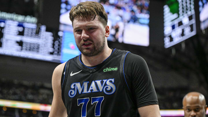 Feb 3, 2024; Dallas, Texas, USA; Dallas Mavericks guard Luka Doncic (77) leaves the game after he appears to suffer a leg injury as he battles for the loose ball with Milwaukee Bucks forward Giannis Antetokounmpo (34) during the first quarter at the American Airlines Center. Mandatory Credit: Jerome Miron-Imagn Images Feb 3, 2024; Dallas, Texas, USA; Dallas Mavericks guard Luka Doncic (77) leaves the game after he appears to suffer a leg injury as he battles for the loose ball with Milwaukee Bucks forward Giannis Antetokounmpo (34) during the first quarter at the American Airlines Center. Mandatory Credit: Jerome Miron-Imagn Images