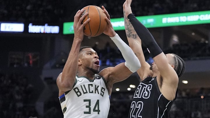 Jan 2, 2025; Milwaukee, Wisconsin, USA; Milwaukee Bucks forward Giannis Antetokounmpo (34) drives to the basket against Brooklyn Nets forward Jalen Wilson (22) in the first half at Fiserv Forum. Mandatory Credit: Michael McLoone-Imagn Images