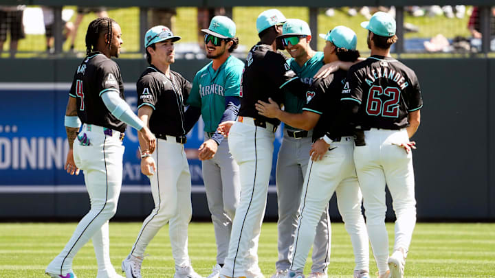 The Arizona Diamondbacks greet their former teammates Seattle Mariners Josh Rojas and Dominic Canzone during a spring training game at Salt River Fields on March 22, 2024. The Arizona Diamondbacks greet their former teammates Seattle Mariners Josh Rojas and Dominic Canzone during a spring training game at Salt River Fields on March 22, 2024.