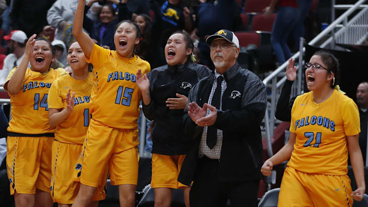 Alchesay's Darien Hill (15) celebrates on the bench after a three pointer from Laney Lupe gave their team the lead late in the second half against Scottsdale Christian during the 2A girls basketball state championship game at Gila River Arena in Glendale, Ariz. on February 23, 2019.

Z6i5238