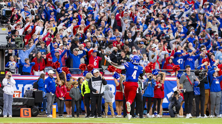 Devin Neal and Kansas stunned Colorado, scoring a third straight upset victory. Devin Neal and Kansas stunned Colorado, scoring a third straight upset victory.