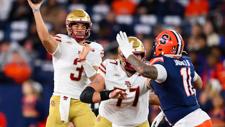 Nov 29, 2025; Syracuse, New York, USA; Boston College Eagles quarterback Grayson James (3) passes the ball as Syracuse Orange defensive lineman Denis Jaquez Jr. (11) defends during the first half at the JMA Wireless Dome. Mandatory Credit: Rich Barnes-Imagn Images