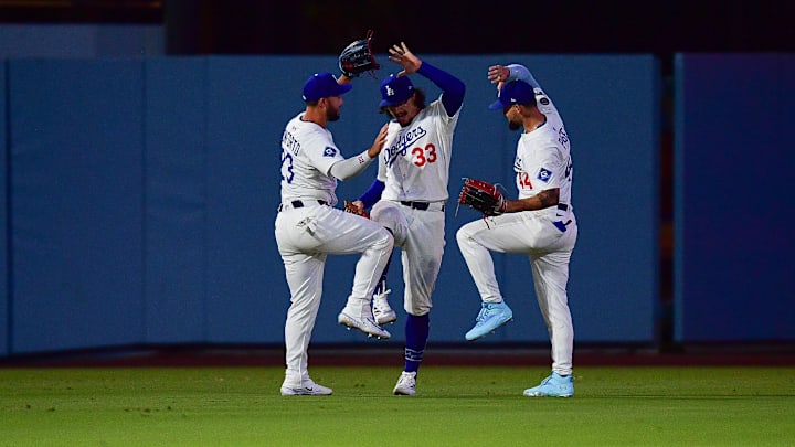 Jul 21, 2025; Los Angeles, California, USA; Los Angeles Dodgers left fielder Michael Conforto (23) outfielder James Outman (33) and center fielder Andy Pages (44) celebrate the victory against the Minnesota Twins at Dodger Stadium. Mandatory Credit: Gary A. Vasquez-Imagn Images Jul 21, 2025; Los Angeles, California, USA; Los Angeles Dodgers left fielder Michael Conforto (23) outfielder James Outman (33) and center fielder Andy Pages (44) celebrate the victory against the Minnesota Twins at Dodger Stadium. Mandatory Credit: Gary A. Vasquez-Imagn Images