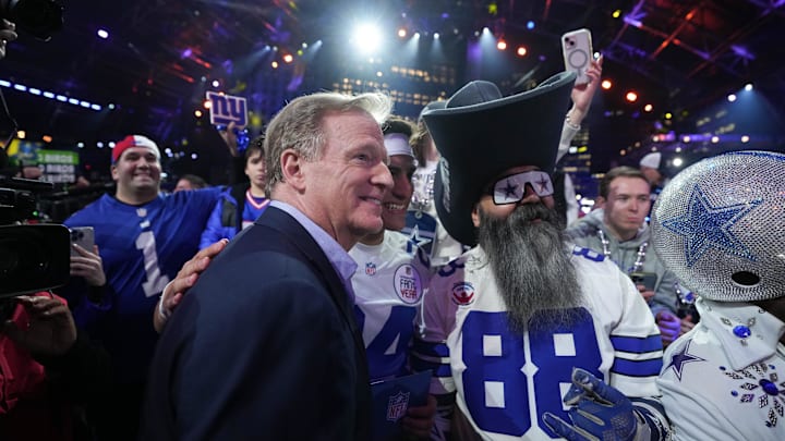NFL commissioner Roger Goodell poses with fans during the 2024 NFL Draft at Campus Martius Park and Hart Plaza. 