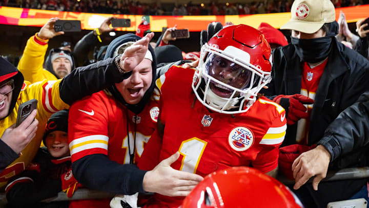 Jan 26, 2025; Kansas City, MO, USA; Kansas City Chiefs wide receiver Xavier Worthy (1) celebrate with fans after a touchdown against the Buffalo Bills during the first half in the AFC Championship game at GEHA Field at Arrowhead Stadium. Mandatory Credit: Mark J. Rebilas-Imagn Images