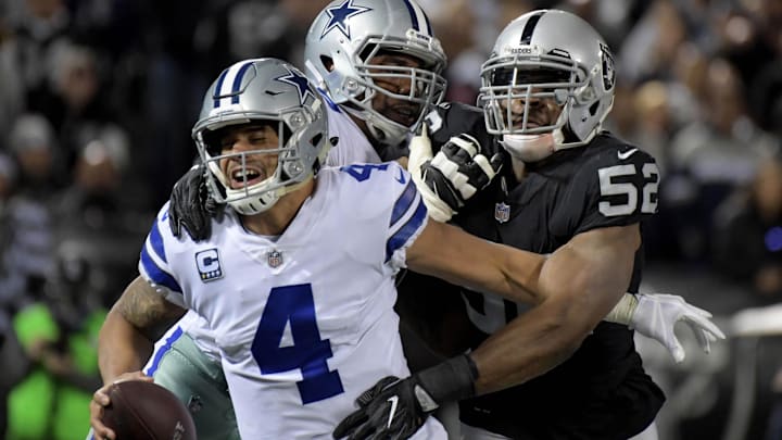 Dallas Cowboys quarterback Dak Prescott is pressured by Oakland Raiders defensive end Khalil Mack. Dallas Cowboys quarterback Dak Prescott is pressured by Oakland Raiders defensive end Khalil Mack.