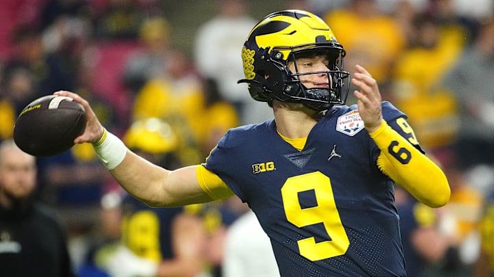 December 31, 2022; Glendale, Ariz; USA; Michigan quarterback JJ McCarthy (9) throws a pass during