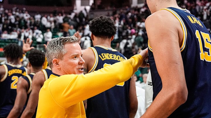 Michigan head coach Dusty May congratulate players after 83-71 win over Michigan State at Breslin Center in East Lansing on Friday, Jan. 30, 2026.