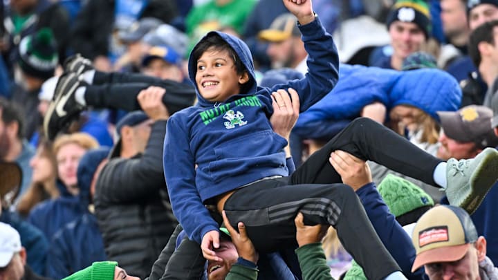 Oct 28, 2023; South Bend, Indiana, USA; Jami Del Pielago, 11, celebrates with fans after a Notre