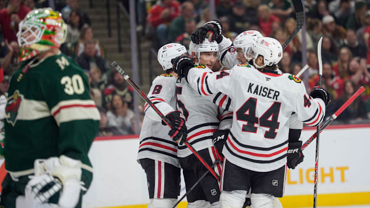 Mar 19, 2026; Saint Paul, Minnesota, USA; Chicago Blackhawks right wing Ilya Mikheyev (95) is congratulated by teammates after scoring against Minnesota Wild goaltender Jesper Wallstedt (30) in the first period at Grand Casino Arena. Mandatory Credit: Matt Blewett-Imagn Images