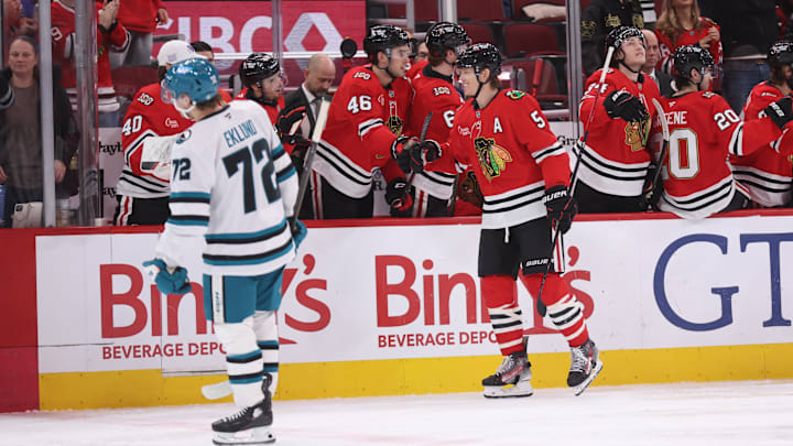 Feb 2, 2026; Chicago, Illinois, USA; Chicago Blackhawks defenseman Connor Murphy (5) high-fives teammates after scoring a second-period goal against the San Jose Sharks at United Center. Mandatory Credit: Talia Sprague-Imagn Images