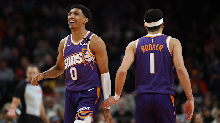 Jan 9, 2025; Phoenix, Arizona, USA; Phoenix Suns forward Ryan Dunn (0) and guard Devin Booker (1) against the Atlanta Hawks in the second half at Footprint Center. Mandatory Credit: Mark J. Rebilas-Imagn Images Jan 9, 2025; Phoenix, Arizona, USA; Phoenix Suns forward Ryan Dunn (0) and guard Devin Booker (1) against the Atlanta Hawks in the second half at Footprint Center. Mandatory Credit: Mark J. Rebilas-Imagn Images