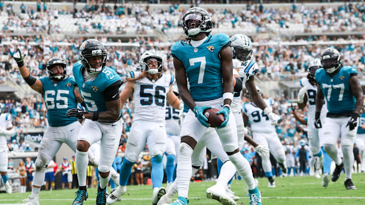 Sep 7, 2025; Jacksonville, Florida, USA; Jacksonville Jaguars wide receiver Brian Thomas Jr. (7) reacts after scoring on a 9-yard touchdown run against the Carolina Panthers during the first half at EverBank Stadium. Mandatory Credit: Nathan Ray Seebeck-Imagn Images