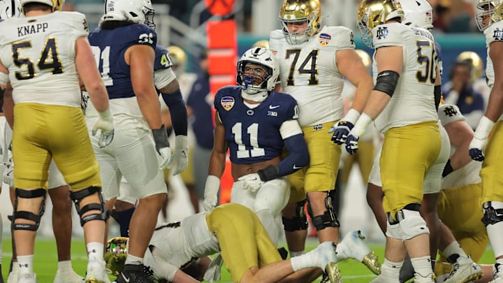 Penn State Nittany Lions defensive end Abdul Carter (11) celebrates a tackle on Notre Dame Fighting Irish quarterback Riley Leonard (13) in the first half in the Orange Bowl at Hard Rock Stadium. Penn State Nittany Lions defensive end Abdul Carter (11) celebrates a tackle on Notre Dame Fighting Irish quarterback Riley Leonard (13) in the first half in the Orange Bowl at Hard Rock Stadium.