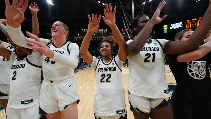 Colorado Buffaloes guard Tameiya Sadler, forward Charlotte Whittaker, guard Shelomi Sanders, and center Aaronette Vonleh celebrate defeating the Oregon Ducks. Colorado Buffaloes guard Tameiya Sadler, forward Charlotte Whittaker, guard Shelomi Sanders, and center Aaronette Vonleh celebrate defeating the Oregon Ducks.