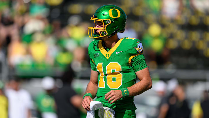 Aug 31, 2024; Eugene, Oregon, USA; Oregon Ducks quarterback Austin Novosad (16) warms up before the game against the Idaho Vandals at Autzen Stadium. Mandatory Credit: Craig Strobeck-Imagn Images