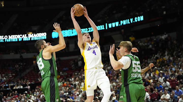 Jul 15, 2024; Las Vegas, NV, USA; Los Angeles Lakers forward Dalton Knecht (4) dunks the ball against Boston Celtics during the first half at Thomas & Mack Center. Mandatory Credit: Lucas Peltier-Imagn Images