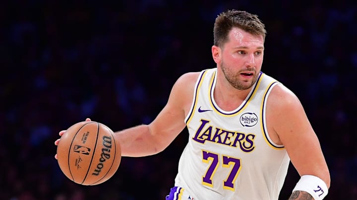 Feb 22, 2026; Los Angeles, California, USA; Los Angeles Lakers guard Luka Doncic (77) moves the ball against the Boston Celtics during the second half at Crypto.com Arena. Mandatory Credit: Gary A. Vasquez-Imagn Images