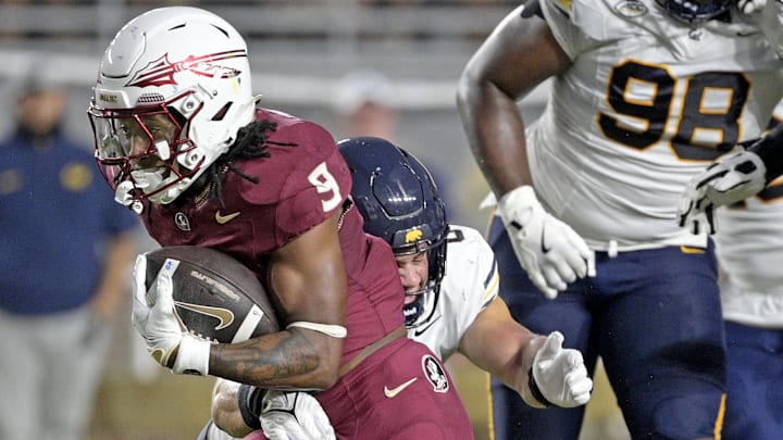 Sep 21, 2024; Tallahassee, Florida, USA; Florida State Seminoles running back Lawrance Toafili (9) runs the ball during the first half against the California Golden Bears at Doak S. Campbell Stadium. Mandatory Credit: Melina Myers-Imagn Images
