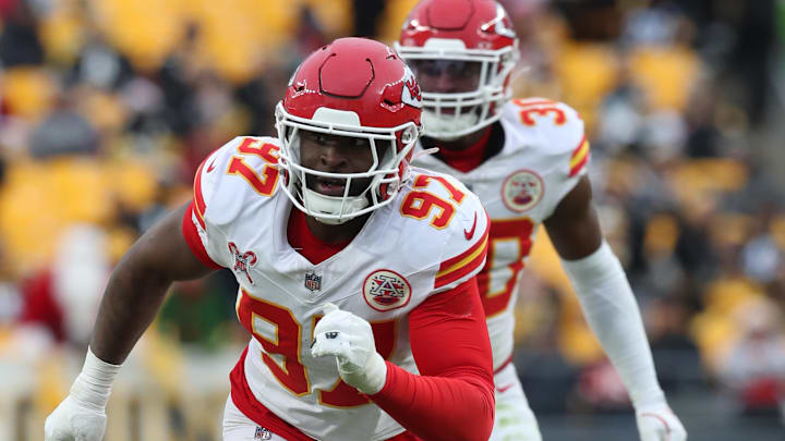 Dec 25, 2024; Pittsburgh, Pennsylvania, USA;  Kansas City Chiefs defensive end Felix Anudike-Uzomah (97)  pass rushes at the line of scrimmage against the Pittsburgh Steelers during the fourth quarter at Acrisure Stadium. Mandatory Credit: Charles LeClaire-Imagn Images