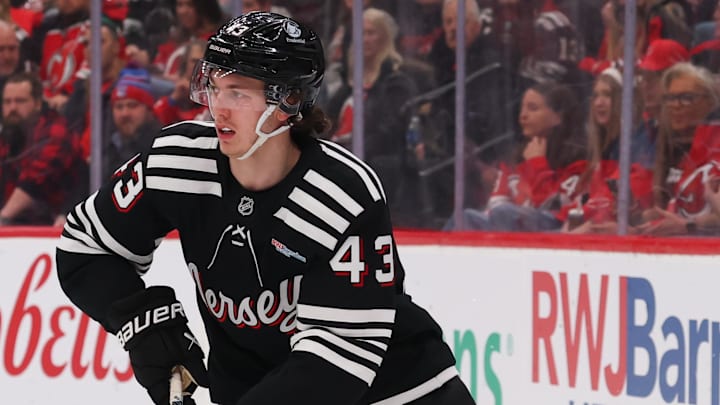 Jan 14, 2026; Newark, New Jersey, USA; New Jersey Devils defenseman Luke Hughes (43) skates with the puck against the Seattle Kraken during the first period at Prudential Center. Mandatory Credit: Ed Mulholland-Imagn Images