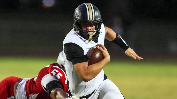 Buchholz quarterback Andrew Whittemore (9) attempts to shake off Santa Fe's Andrew Akins (55) during their game at Santa Fe High School in Alachua on Oct. 1, 2026. Buchholz won that game and is undefeated (9-0) entering its game against Bolles (6-2) on Friday, Oct. 30, 2026. Buchholz quarterback Andrew Whittemore (9) attempts to shake off Santa Fe's Andrew Akins (55) during their game at Santa Fe High School in Alachua on Oct. 1, 2026. Buchholz won that game and is undefeated (9-0) entering its game against Bolles (6-2) on Friday, Oct. 30, 2026.