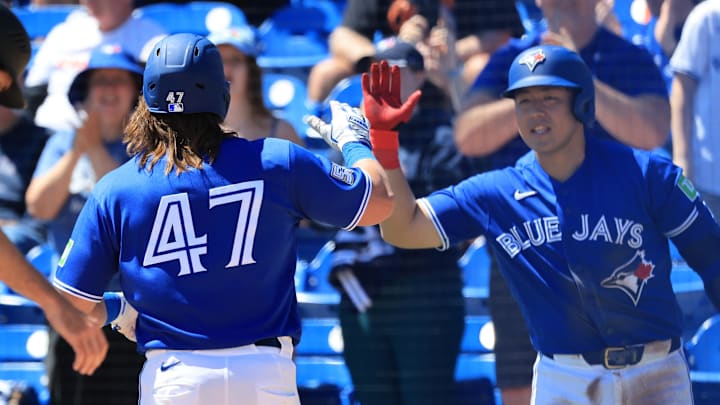 Toronto Blue Jays right fielder Addison Barger is congratulated by third baseman Kazuma Okamoto. Toronto Blue Jays right fielder Addison Barger is congratulated by third baseman Kazuma Okamoto.