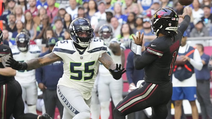 Arizona Cardinals quarterback Kyler Murray (1) throws while pressured by Seattle Seahawks defensive end Dre'Mont Jones (55) during the first quarter at State Farm Stadium in Glendale on Dec. 8, 2024.