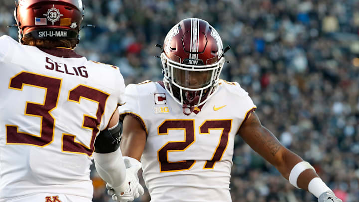 Minnesota linebacker Ryan Selig (33) and defensive back Tyler Nubin (27) celebrate a defensive stop against Purdue Saturday, Nov. 11, 2023, at Ross-Ade Stadium in West Lafayette, Ind. 