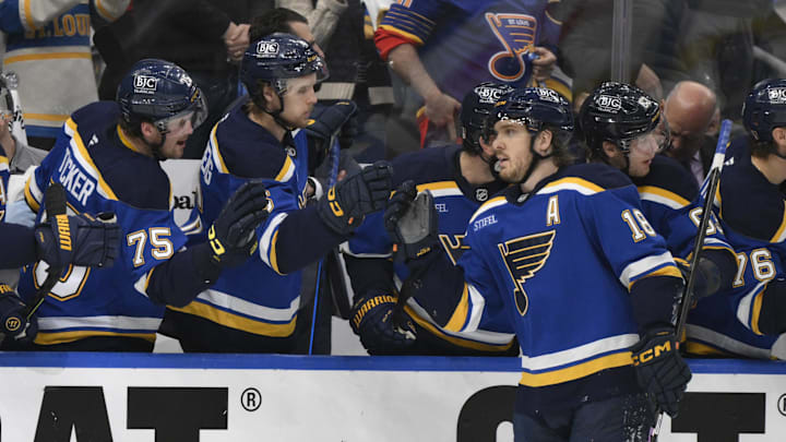 Apr 27, 2025; St. Louis, Missouri, USA; St. Louis Blues center Robert Thomas (18) is congratulated by teammates after scoring a goal against the Winnipeg Jets during the third period in game four of the first round of the 2025 Stanley Cup Playoffs at Enterprise Center. Mandatory Credit: Jeff Le-Imagn Images