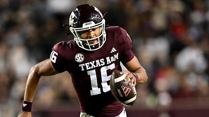 Nov 11, 2023; College Station, Texas, USA; Texas A&M Aggies quarterback Jaylen Henderson (16) runs the ball into the end zone for a touchdown during the second quarter against the Mississippi State Bulldogs at Kyle Field. Mandatory Credit: Maria Lysaker-Imagn Images