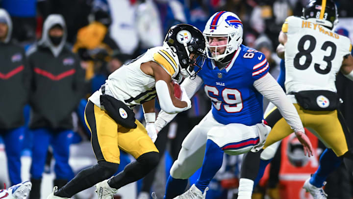 Jan 15, 2024; Orchard Park, New York, USA; Buffalo Bills long snapper Reid Ferguson (69) and Pittsburgh Steelers wide receiver Calvin Austin III (19) on a punt return in the third quarter of a 2024 AFC wild card game Jan 15, 2024; Orchard Park, New York, USA; Buffalo Bills long snapper Reid Ferguson (69) and Pittsburgh Steelers wide receiver Calvin Austin III (19) on a punt return in the third quarter of a 2024 AFC wild card game