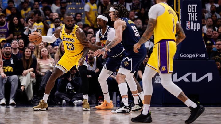 Apr 29, 2024; Denver, Colorado, USA; Los Angeles Lakers forward LeBron James looks to pass to point guard D'Angelo Russell. Apr 29, 2024; Denver, Colorado, USA; Los Angeles Lakers forward LeBron James looks to pass to point guard D'Angelo Russell.