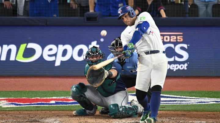 Oct 20, 2025; Toronto, Ontario, CAN; Toronto Blue Jays right fielder George Springer (4) hits a three run home run against the Seattle Mariners in the seventh inning during game seven of the ALCS round for the 2025 MLB playoffs at Rogers Centre. Mandatory Credit: Dan Hamilton-Imagn Images