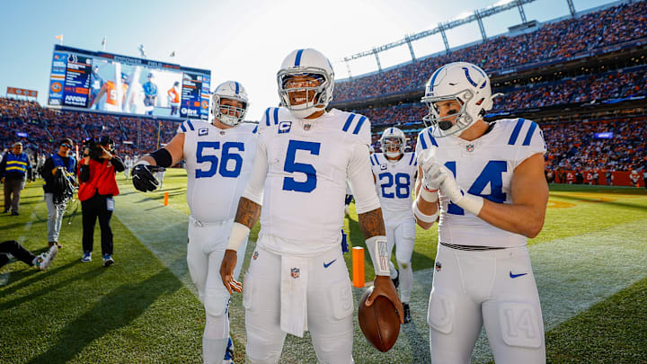 Dec 15, 2024; Denver, Colorado, USA; Indianapolis Colts quarterback Anthony Richardson (5) celebrates with guard Quenton Nelson (56) and wide receiver Alec Pierce (14) after a touchdown in the first quarter against the Denver Broncos at Empower Field at Mile High. Mandatory Credit: Isaiah J. Downing-Imagn Images