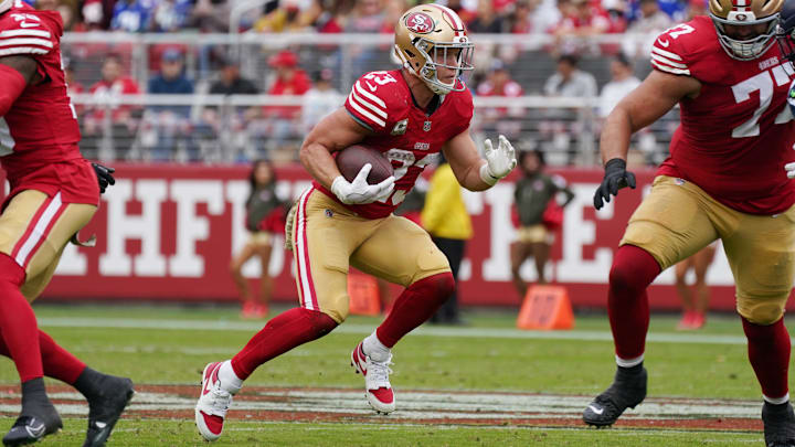 Nov 17, 2024; Santa Clara, California, USA; San Francisco 49ers running back Christian McCaffrey (23) rushes the ball against the Seattle Seahawks in the second quarter at Levi's Stadium. Mandatory Credit: David Gonzales-Imagn Images